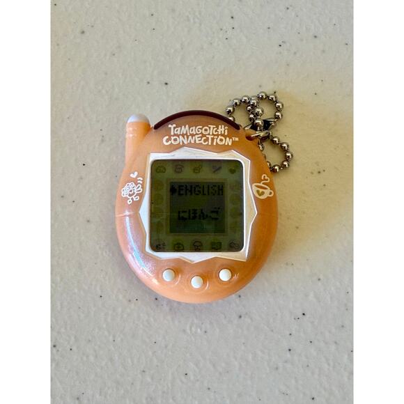 NEW Tamogotchi Connection 2023 Tan/Pink - Picture 1 of 3